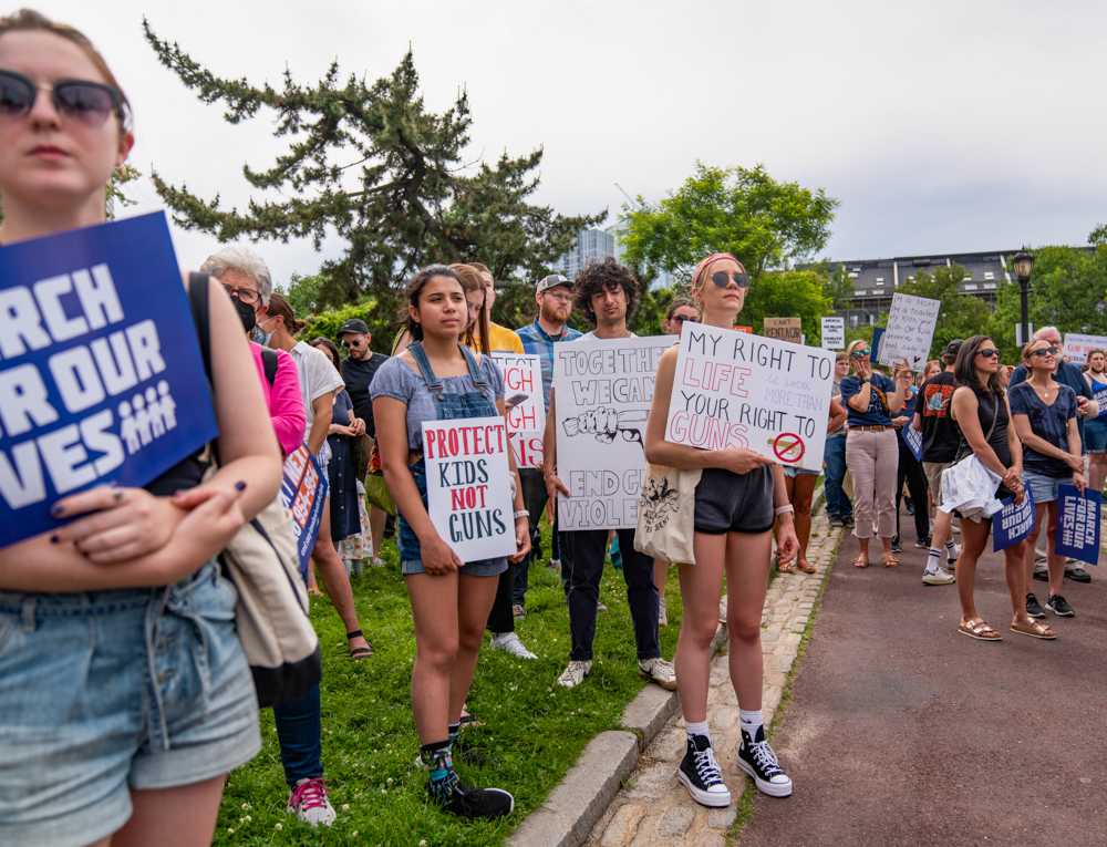 Protesters hold up signs while listening to speakers during the Boston March for Our Lives last June. HUI-EN LIN/DFP PHOTOGRAPHER