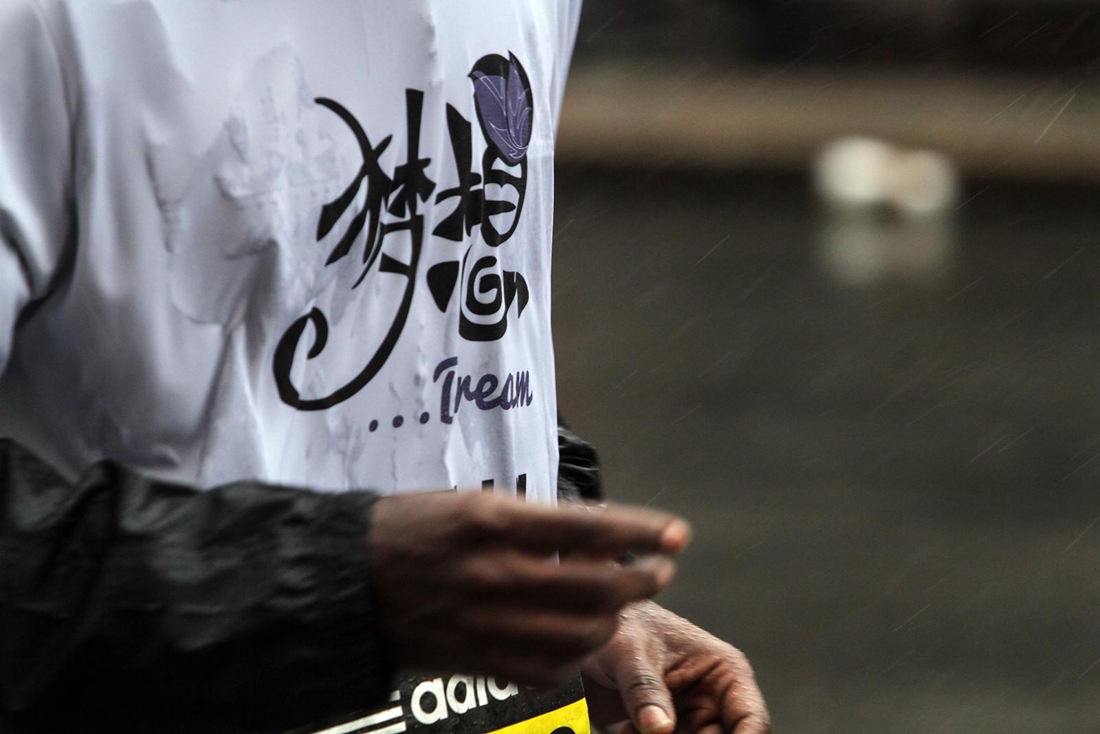 A participant, running for the Lingzi Foundation, races down Boylston Street Monday during the Boston Marathon. PHOTO BY ALEXANDRA WIMLEY/DAILY FREE PRESS STAFF