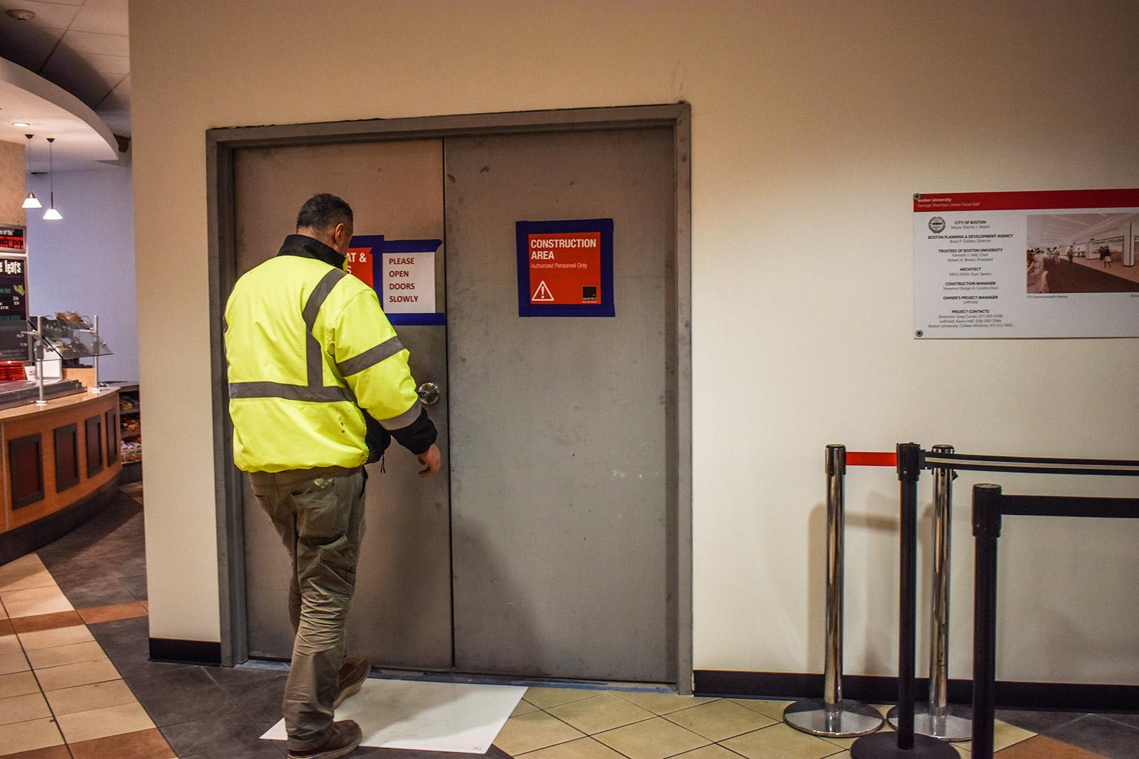 A worker enters the construction area in the George Sherman Union. Renovations to expand and redesign the food court and kitchen are set to be finished by the Fall 2020 semester. LAURYN ALLEN/ DAILY FREE PRESS STAFF
