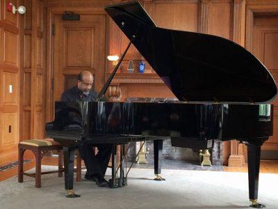 leland clarke plays the piano at a concert