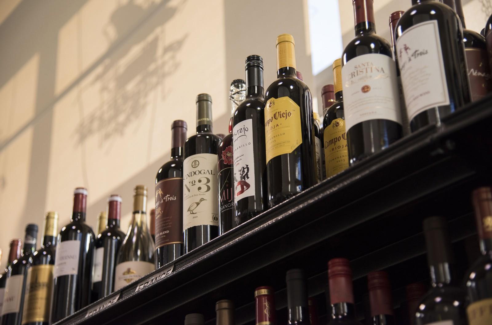 Liquor stores have been deemed essential businesses, staying open in Massachusetts and other states throughout the coronavirus outbreak. Experts say closing them could exacerbate addicts’ withdrawal symptoms, which they would be unable to get treatment for as many rehabilitation centers are closed. LEXI PLINE/ DFP FILE
