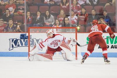 Jake Oettinger stretches low to block Evan Jasper's penalty shot in the second period. PHOTO BY JUSTIN HAWK