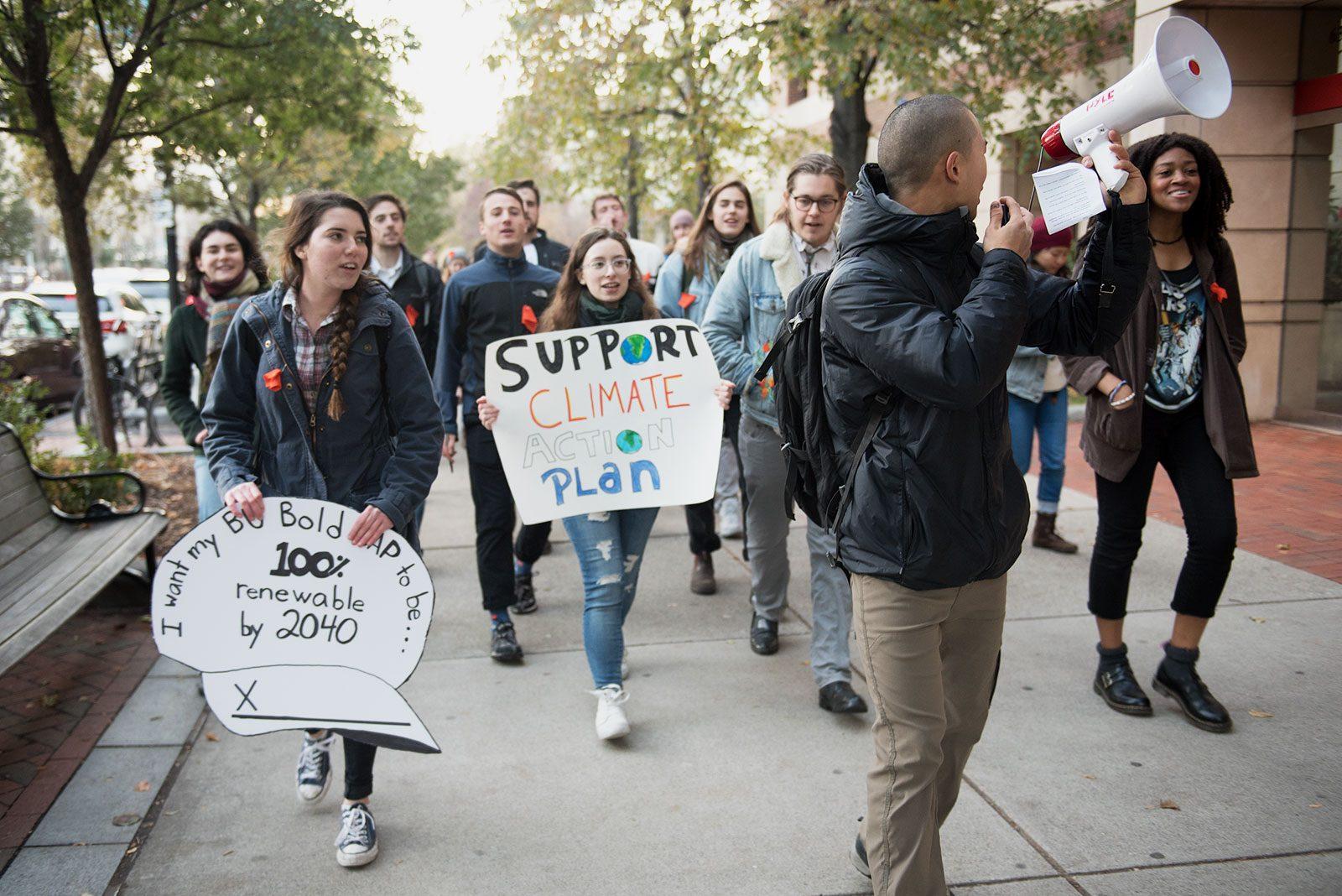 Students walk through campus as part of a divestment march organized by DivestBU in November 2017. The student group continues to be a vocal advocate for environmental sustainability on campus. MAISIE MANSFIELD-GREENWALD/ DFP FILE