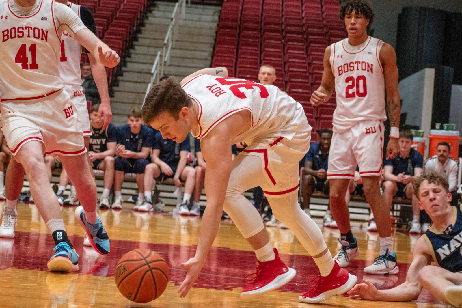 Sophomore guard Michael McNair (20) watches as junior guard Ben Roy (30) steals the ball from a Navy player during a game on Wednesday. Boston University secured an eighth-consecutive victory, defeating Navy 87-65. JOHN DOWNES/DFP PHOTOGRAPHER 