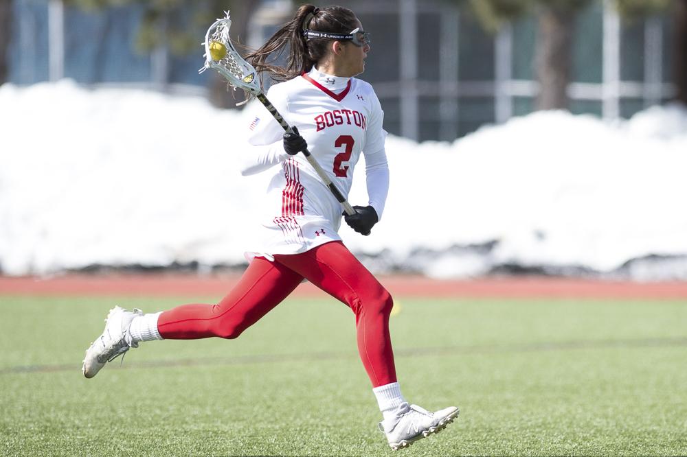 Junior midfielder Kaitlin Belval led her team with seven wins at the faceoff X and was key for BU maintaining possession in the team's win over Harvard Wednesday night. PHOTO BY MADDIE MALHOTRA/DAILY FREE PRESS STAFF