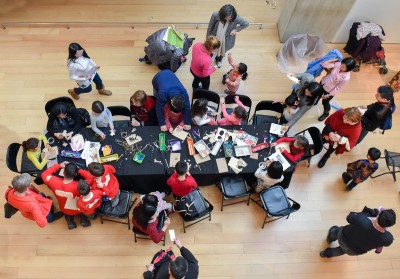 Young visitors make monkey puppets to celebrate the Year of the Monkey. PHOTO BY MADDIE MALHOTRA/DAILY FREE PRESS STAFF