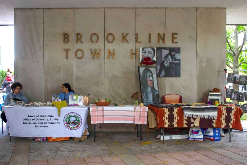Booths commemorating Indigenous People’s Day set up outside of Brookline Town Hall at an event hosted by the Brookline Indigenous Peoples Celebration Committee on Monday. The event showcased artists and advocacy groups seeking to educate people on indigenous culture and issues. SEAN YOUNG/DFP PHOTOGRAPHER