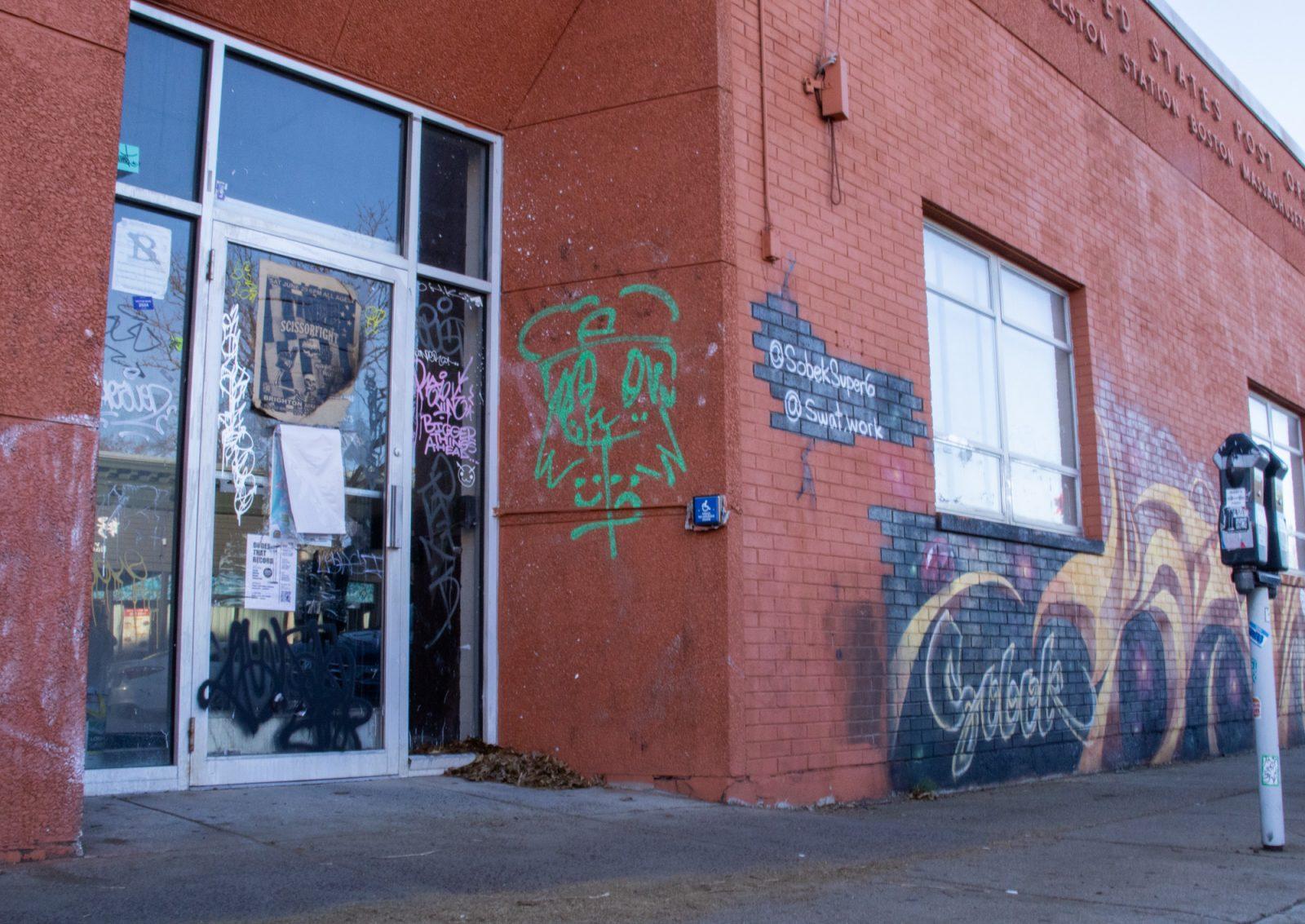 A graffitied vacant storefront in Allston. The Boston City Council proposed a vacancy tax for empty storefronts during a hearing on Friday. PHOTO BY GEORGE LEHMAN