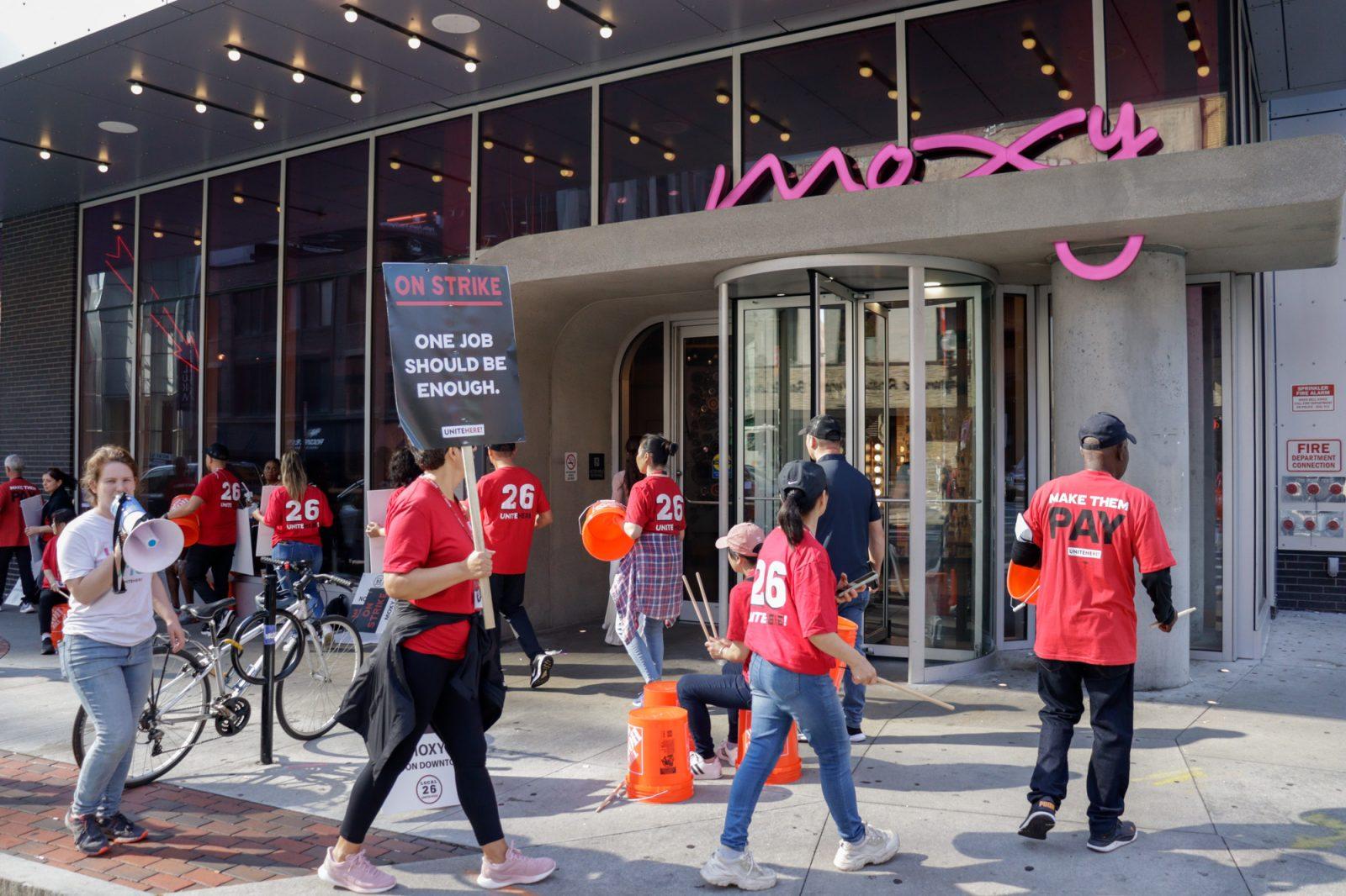 Hotel workers picketing outside of Moxy Boston Downtown hotel on Tremont Street on Saturday. Workers from four Boston hotels went on strike after UNITE HERE Local 26 authorized the citywide strike on Aug. 8. PHOTO BY LAUREN ALBANO