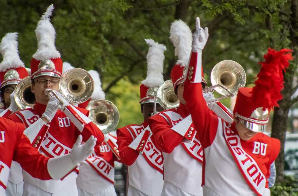 The Boston University Marching Band performs on Commonwealth Avenue during the 2021 Matriculation ceremony. The band honored iconic female singers from the 80’s by performing songs by Whitney Houston, Madonna and more at their show on Saturday. SHANNON DAMIANO/DFP FILE