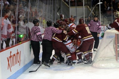 BU and BC get into a scrum during Friday's game at Agganis Arena. PHOTO BY DANIEL GUAN/DAILY FREE PRESS STAFF