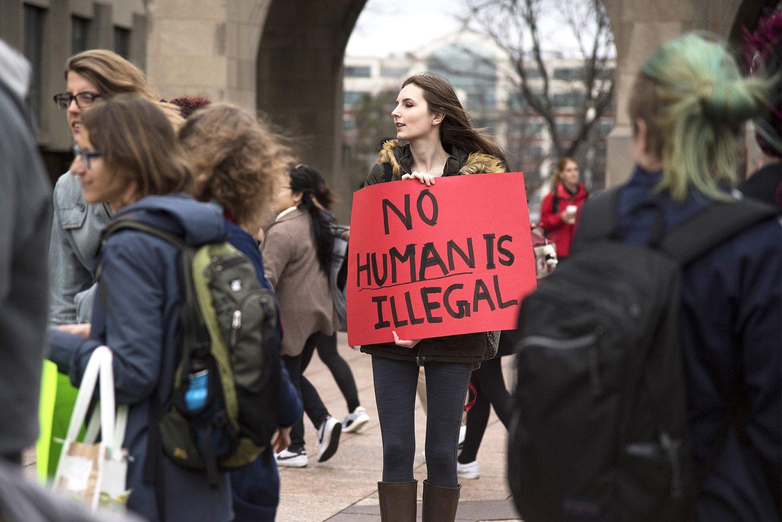 Protesters gather at Marsh Plaza Wednesday afternoon to fight recent domestic and foreign actions taken by President Donald Trump’s administration. PHOTO BY LEXI PLINE/ DAILY FREE PRESS STAFF