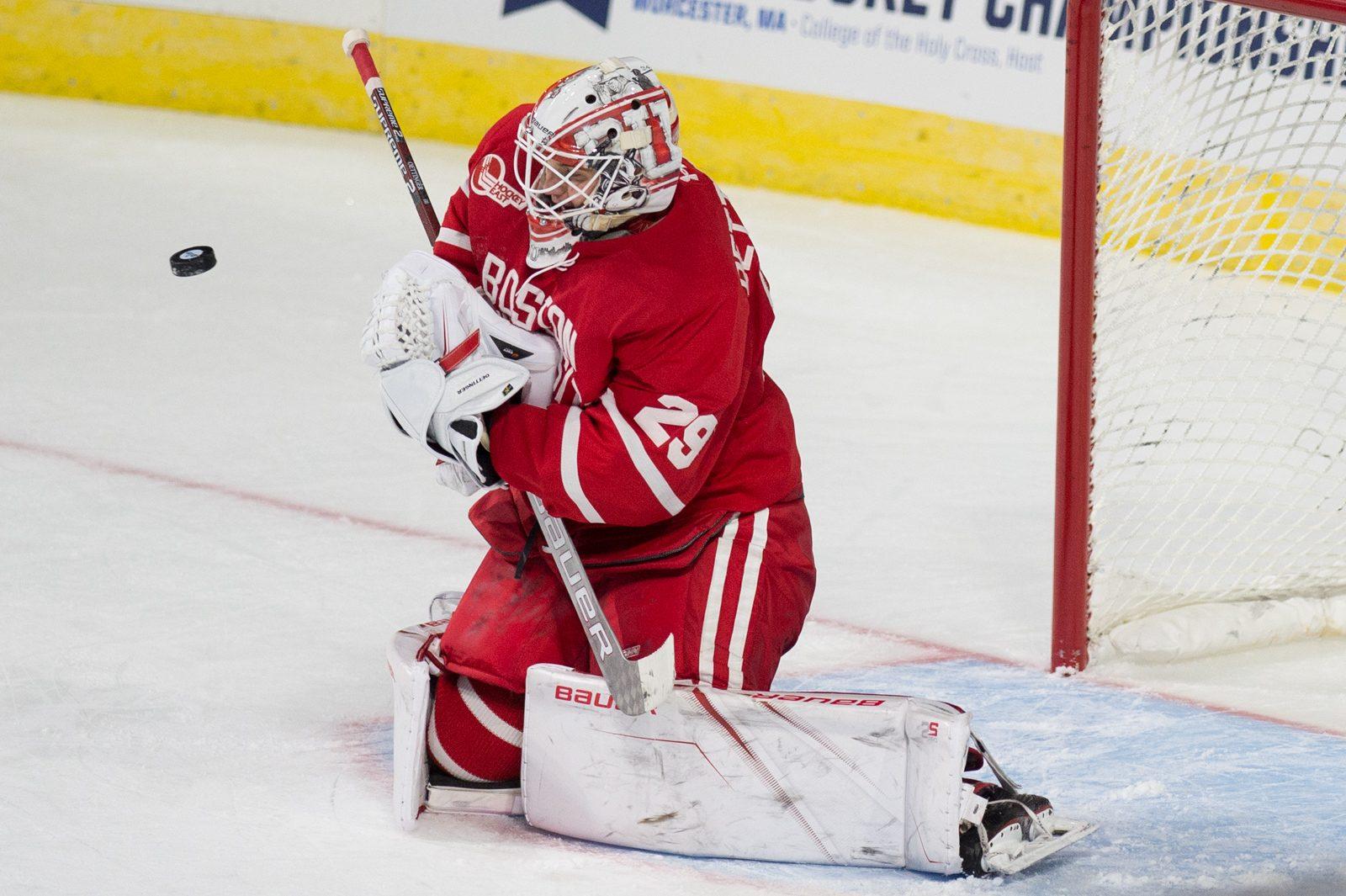Sophomore goaltender Jake Oettinger makes a save in the NCAA Northeast Regional Saturday at the DCU Center. PHOTO BY MADDIE MALHOTRA/ DAILY FREE PRESS STAFF 