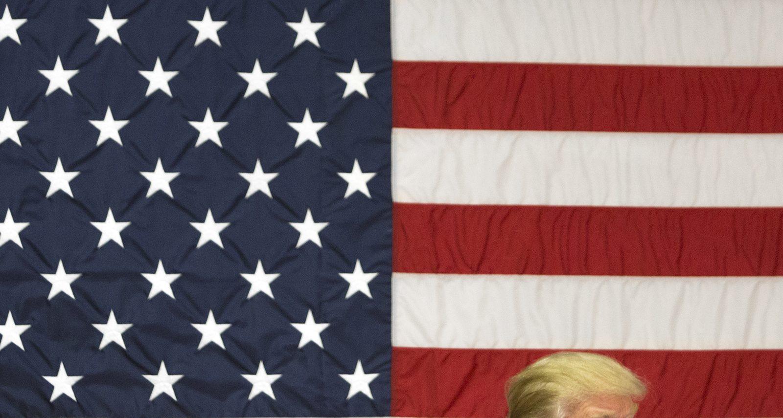 Republican presidential candidate Donald Trump dons his signature hair style at an event held in the Sandown, New Hampshire Town Hall Thursday evening. PHOTO BY SARAH SILBIGER/ DAILY FREE PRESS STAFF 