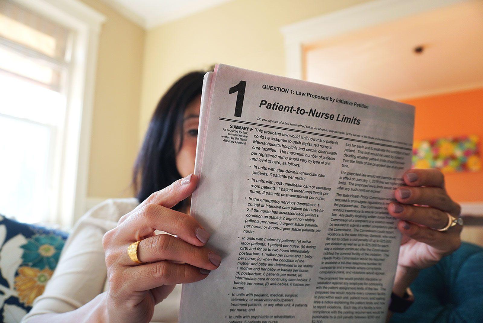 Brookline resident Susan Park reads about patient-to-nurse limits in the Massachusetts 2018 Ballot Questions booklet. ILLUSTRATION BY SOPHIE PARK/ DAILY FREE PRESS STAFF