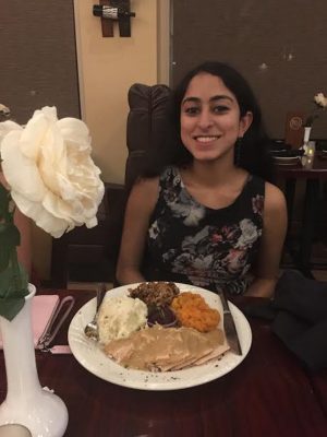 Nitya Rudraraju (ENG ‘19) poses with her plate at the restaurant where she ate her Thanksgiving meal. PHOTO COURTESY NITYA RUDRARAJU