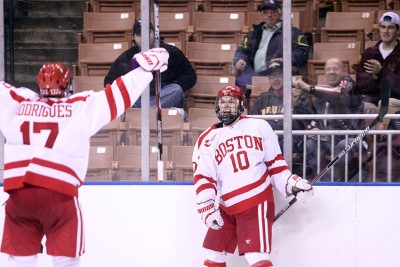 Junior forward Dannu O'Regan (10) celebrates after scoring in overtime against Yale University, PHOTO BY MAYA DEVEREAUX/DAILY FREE PRESS STAFF