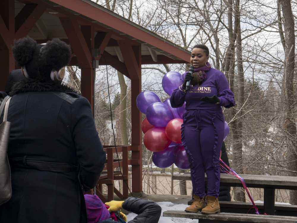 Bernadine Desanges speaks at the “100 Women Project: Survivors in Solidarity” on Sunday morning. The event aimed to bring survivors of sexual assault and their allies together for a photo shoot. PHOTO BY FELIX PHILLIPS/ DAILY FREE PRESS STAFF 

