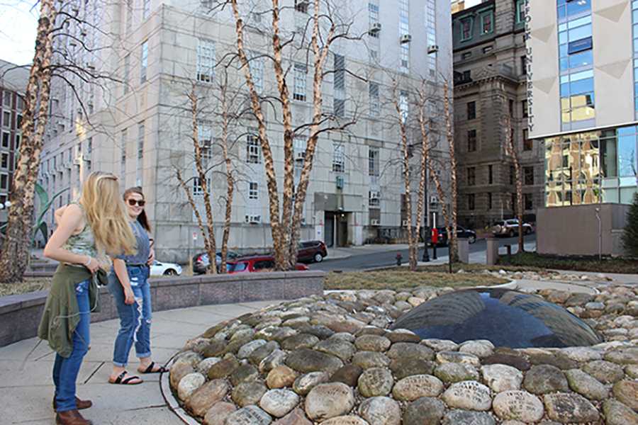 Visitors stand in the Garden of Peace, a memorial to victims of homicide in Boston. PHOTO BY HANNAH ROGERS/ DAILY FREE PRESS STAFF
