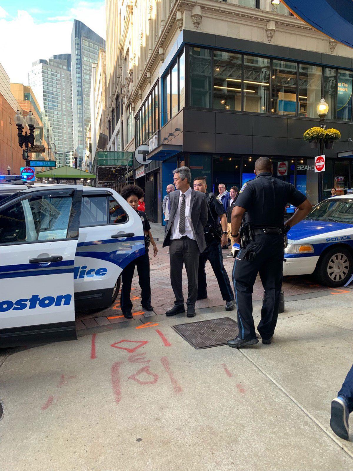 Boston police officers escorting Professor Nathan Philips after arresting him for a trespassing charge. The charge was later dropped and Philips was released. COURTESY OF FRRACS
