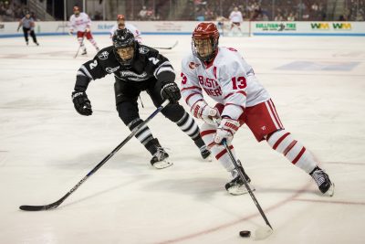 BOSTON, MA - DECEMBER 03: Boston University Terriers forward Nikolas Olsson (13) moves the puck around Providence College Friars defenseman Vincent Desharnais (2) during the first period of the game between the Providence College Friars and the Boston University Terriers on December 3rd, 2016, at Agganis Arena in Boston, MA. (Photo by John Kavouris/Daily Free Press)