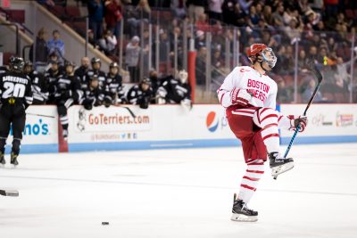 BU defenseman Brandon Hickey (4) celebrates a goal, bringing the Terriers back into contention, during the third period of the game between the Providence College Friars and the Boston University Terriers on December 3rd, 2016, at Agganis Arena in Boston, MA. (Photo by John Kavouris/Daily Free Press)