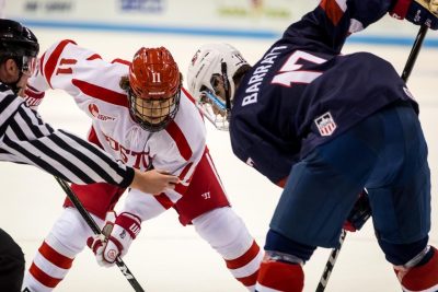 Terrier forward Patrick Curry (11) faces off against USA forward Evan Barratt (17) during the game between the Boston University Terriers and the USA Hockey's U-18 Development Team at Agganis Arena in Boston, MA. PHOTO BY JOHN KAVOURIS/DAILY FREE PRESS