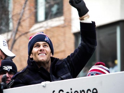 Tom Brady waves to fans on February 4 during the Patriots parade down Boylston Street. PHOTO BY ALEXANDRA WIMLEY/DFP FILE PHOTO
