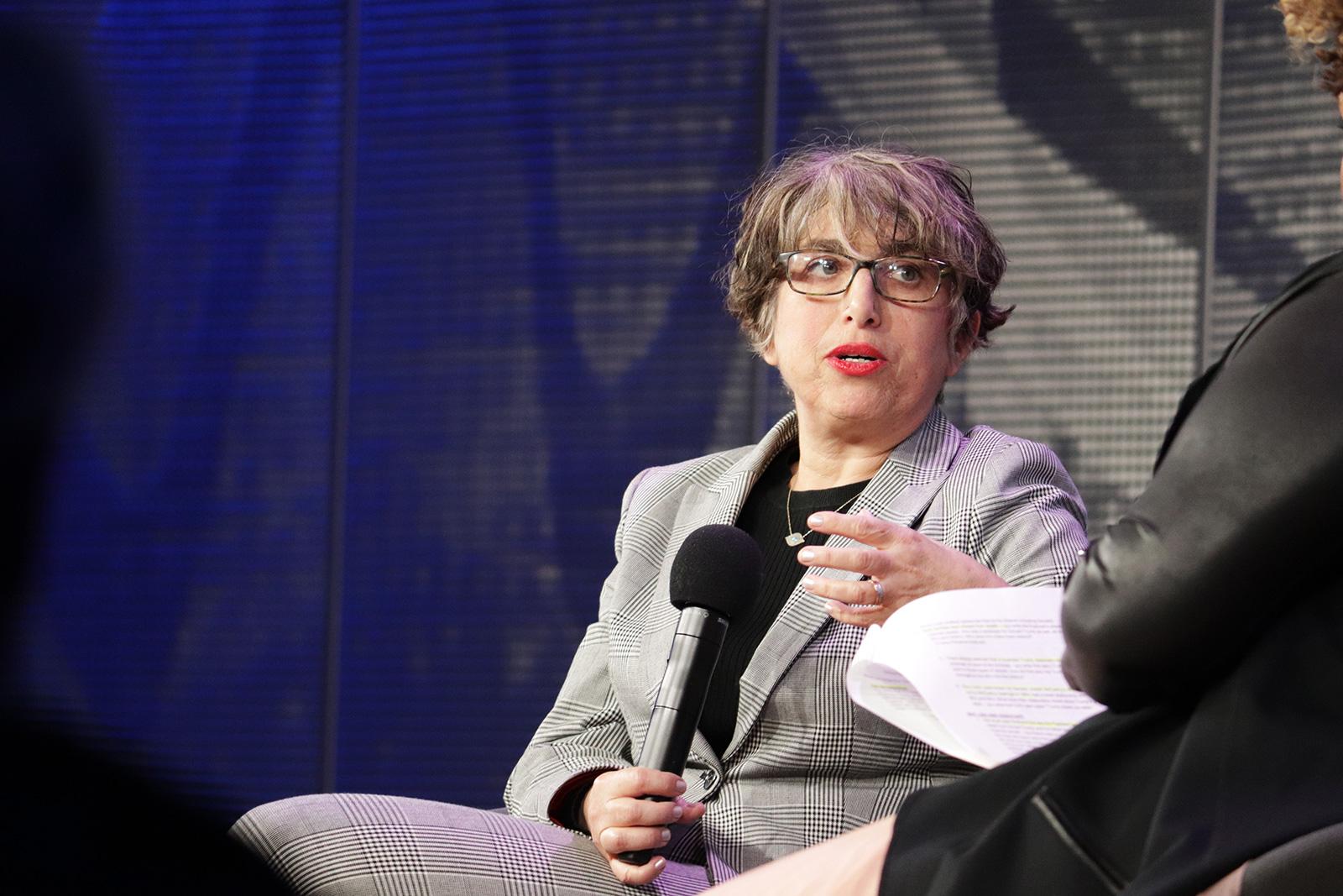 Andrea Bernstein, co-host of the podcast “Trump, Inc.,” speaks about her new book, "American Oligarchs: The Kushners, the Trumps, and the Marriage of Money and Power,” at WBUR CitySpace Wednesday. PERRY SOSI/ DAILY FREE PRESS STAFF
