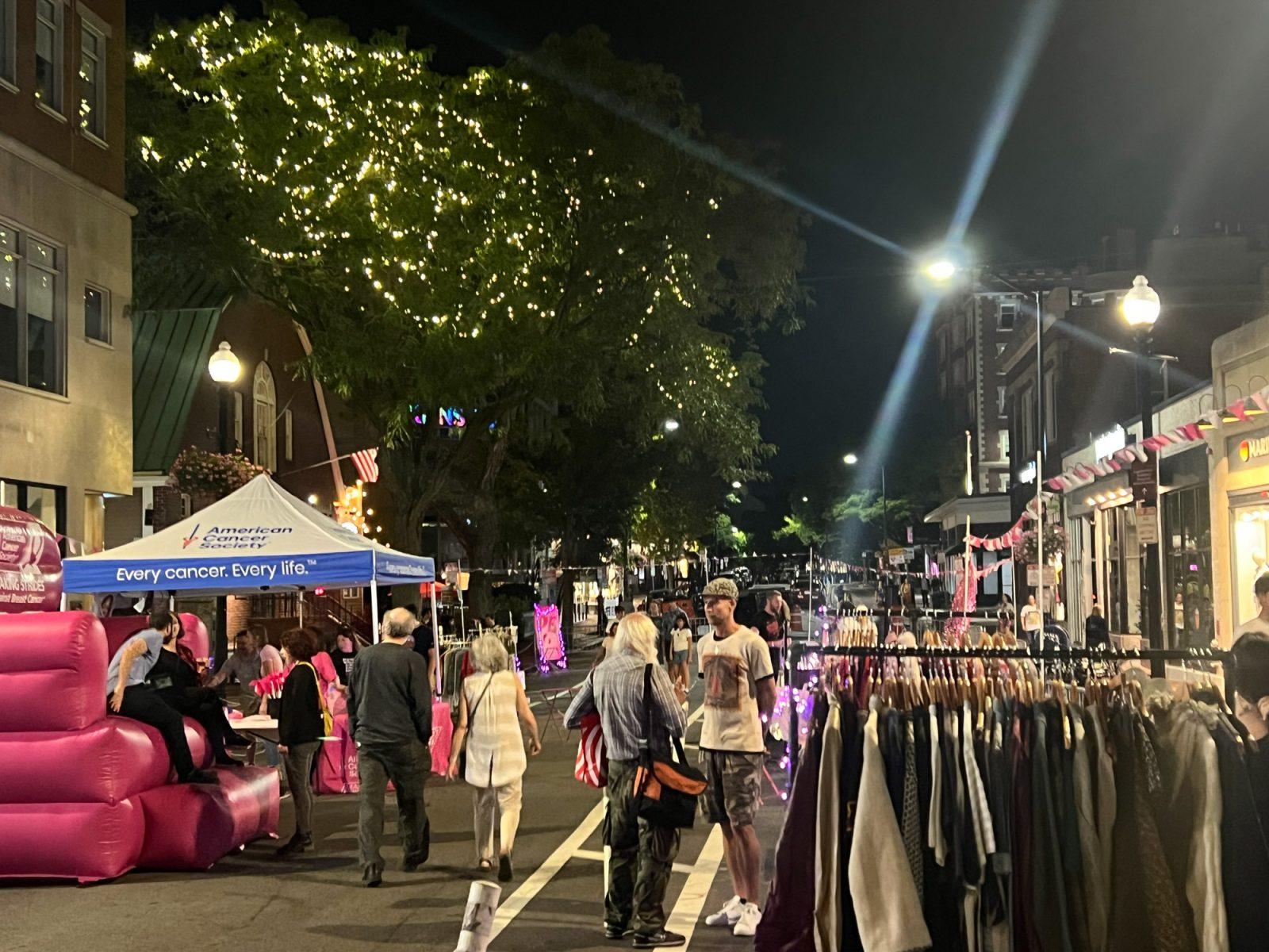 People walk around Brattle Street during Paint the Square PINK on Friday. Paint the Square PINK is a block party hosted by the Harvard Square Business Association in partnership with the American Cancer Society to honor breast cancer survivors. COURTESY OF HARVARD SQUARE BUSINESS ASSOCIATION