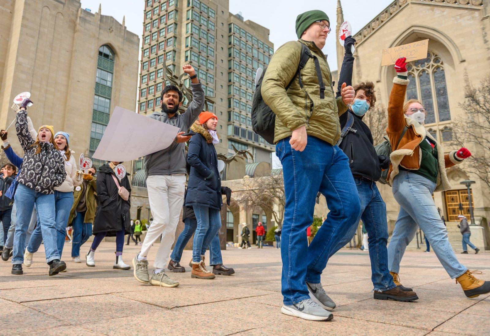 Members of the Boston University Graduate Workers Union march during a rally at Marsh Plaza on Monday. MOLLY POTTER/DFP PHOTOGRAPHER
