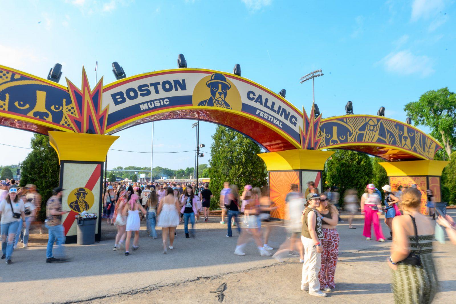 Boston Calling attendees take pictures in front of the entrance to the festival. MOLLY POTTER/DFP PHOTOGRAPHER