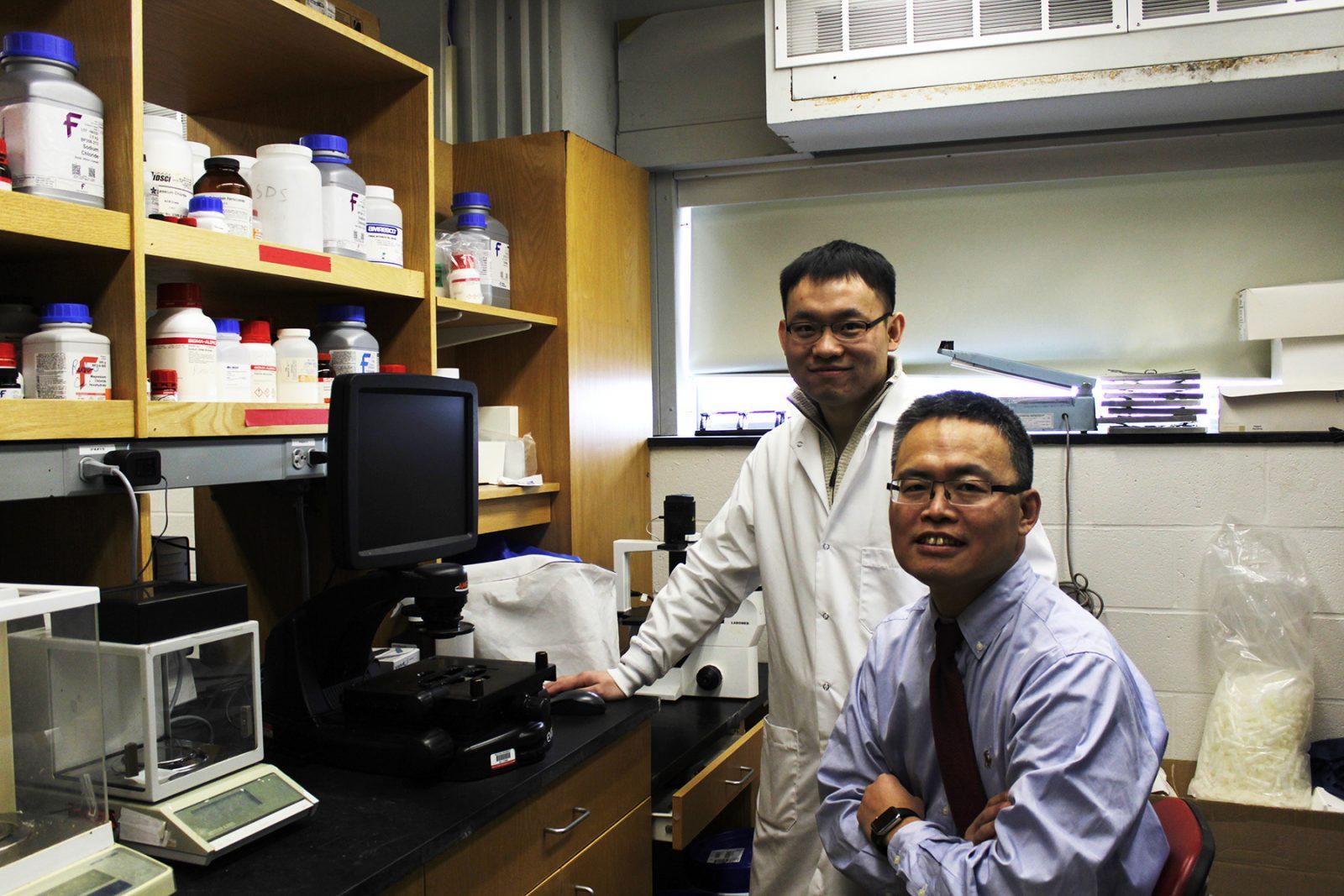 Boston University School of Medicine professor Rutao Cui and medical student Chengqian Yin in their on campus research lab. Cui is leading an international research team, which has discovered a potential new way to stop the progression of melanoma. RACHEL SHARPLES/ DAILY FREE PRESS STAFF