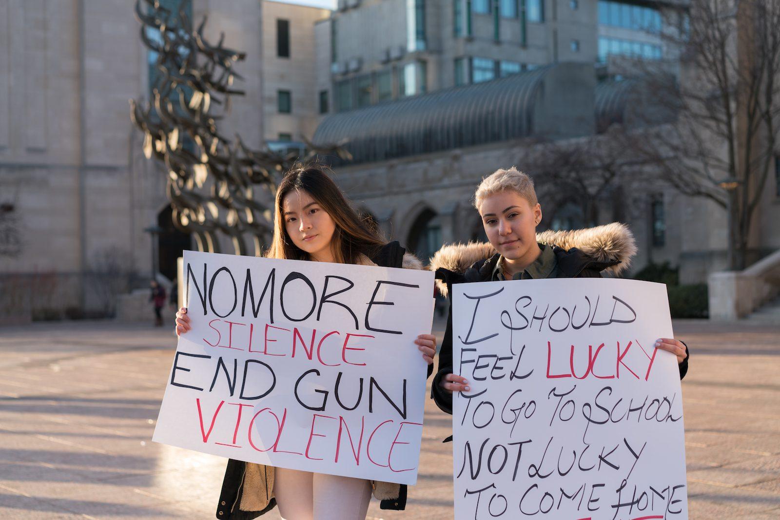 Dnee Sirichantaropas and Dena AlFadhli at the anti-gun rally at BU on Monday afternoon. PHOTO BY DENGFENG YANG/ DAILY FREE PRESS STAFF 

