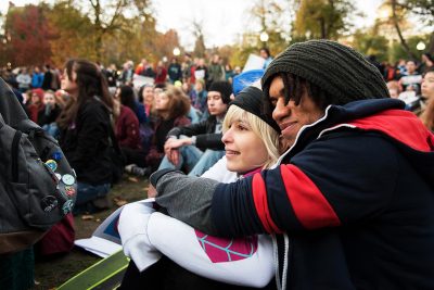 Members of the crowd at the "Love Trumps Hate" peace rally react to the speeches given Friday evening in the Boston Common. PHOTO BY LAUREN PETERSON/ DAILY FREE PRESS STAFF