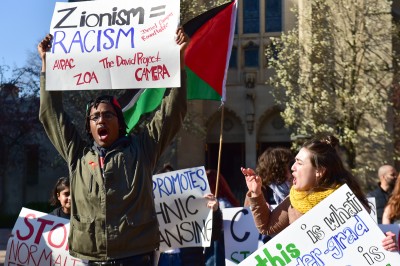 A member of Boston Students for Justice in Palestine protests the Israel Indie Freedom Fest in Marsh Plaza Sunday afternoon. PHOTO BY MADDIE MALHOTRA/DAILY FREE PRESS STAFF