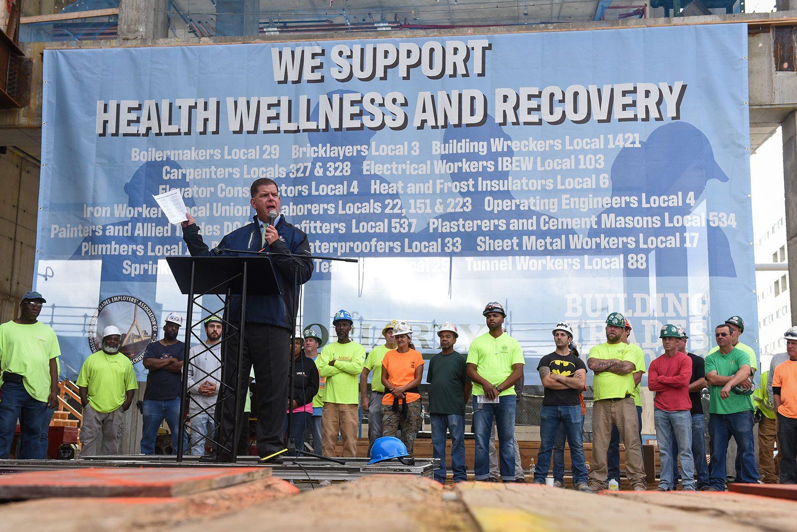 On Sep. 4, Boston Mayor Martin Walsh spoke at a construction site in the Seaport District as part of the city’s month-long programming for National Recovery Month. Workers observed a moment of silence to honor the 150 out of 100,000 construction workers lost to opioid-related deaths. COURTESY OF THE CITY OF BOSTON.