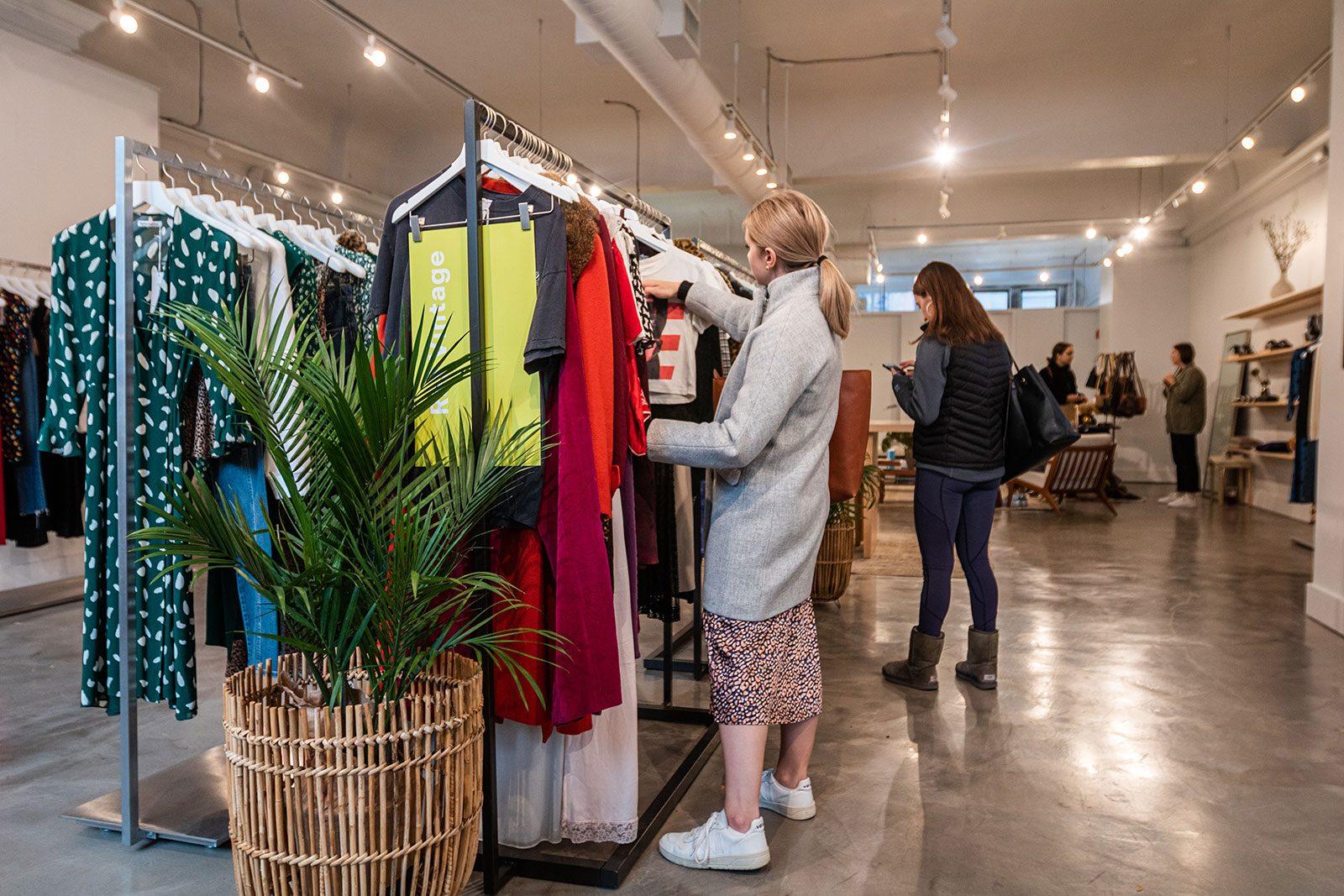 Customers browse through clothes on display during Reformation’s vintage trunk show this past weekend at its storefront on Newbury Street. SOFIA KOYAMA/ DAILY FREE PRESS STAFF