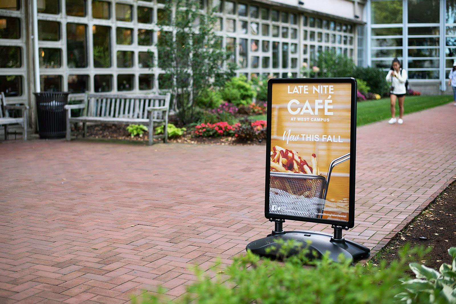 An advertisement in West Campus for the new Late Nite Café opening in the West Dining Hall. Rhett’s West, the old late-night eatery located just adjacent to the dining hall, is being converted into a student lounge. MAISIE MANSFIELD-GREENWALD/ DAILY FREE PRESS STAFF