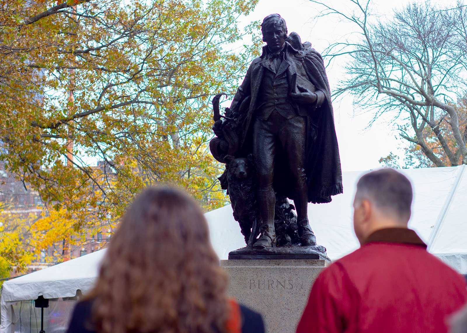 Visitors at the restoration event for a statue of poet Robert Burns, which was moved from Winthrop Square to the Back Bay Fens. CONOR KELLEY/ DAILY FREE PRESS STAFF