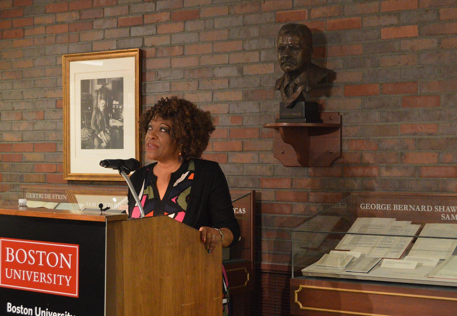Pulitzer Prize-winner and former Poet Laureate Rita Dove looks into the distance as reads her poetry to a crowded room in Mugar Library. PHOTO BY CAROLYN KOMATSOULIS/ DAILY FREE PRESS STAFF