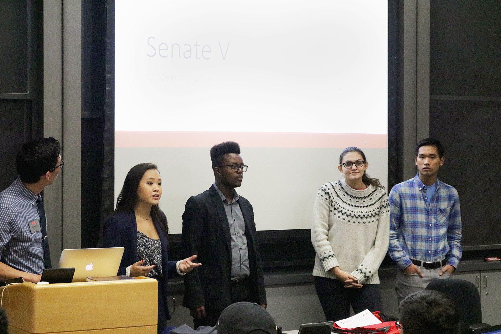From left to right: College of Arts and Sciences Student Government Sens. Jessica Zheng, Amos Mwuara, Savannah Majarwitz and Matthew Yee present the Senate Outreach Program Proposal, which was voted on and passed Monday night. SOFIA KOYAMA/ DAILY FREE PRESS STAFF