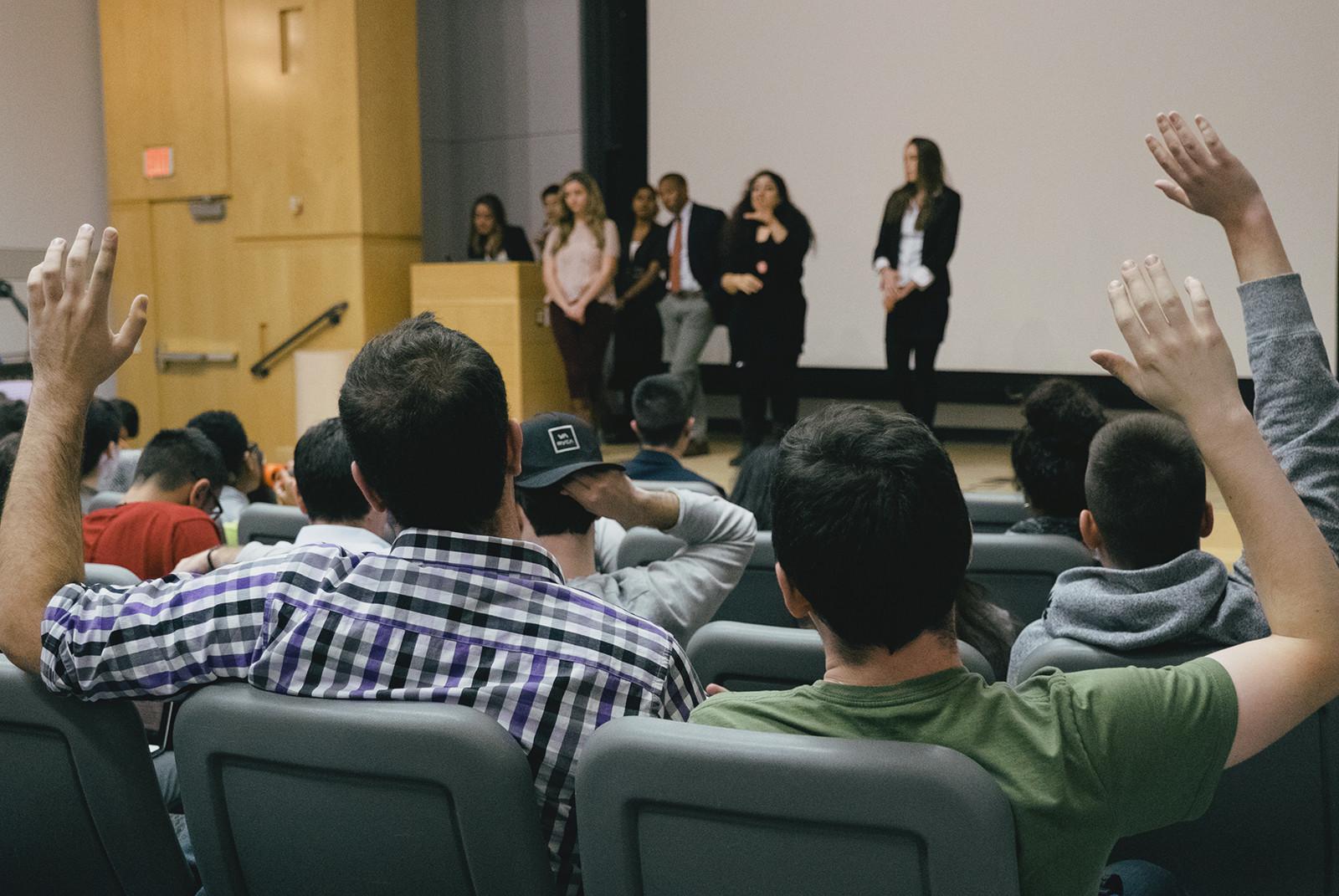Boston University student government senators raise their hands to offer opinions for the new direction for the organization during a meeting on Monday. PHOTO BY BRIAN SONG/DAILY FREE PRESS STAFF