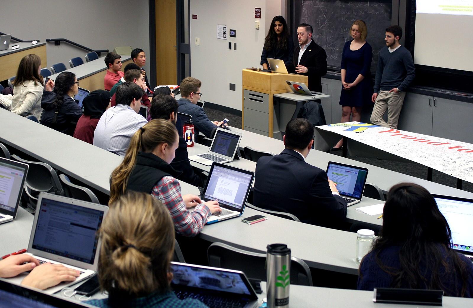 Avi Levy (CAS ’15), chairman of the Student Government Rules Committee, speaks at SG Senate meeting Monday at the Boston University Photonics Center. PHOTO BY BETSEY GOLDWASSER/DAILY FREE PRESS STAFF