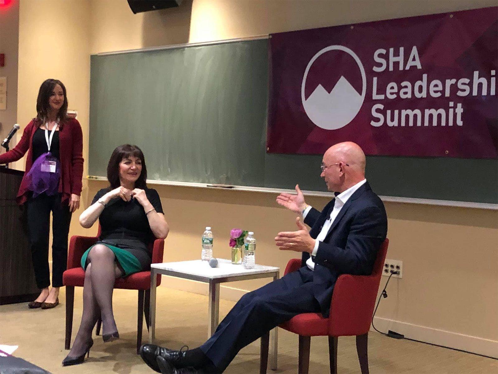 Boston University School of Hospitality Administration professor Taylor Peyton, far left, oversees panelists Vera Manoukian of Hilton Hotels and Resorts and Anthony Melchiorri of the Travel Channel’s Hotel Impossible at the 2018 SHA Leadership Summit. COURTESY OF BU SCHOOL OF HOSPITALITY ADMINISTRATION