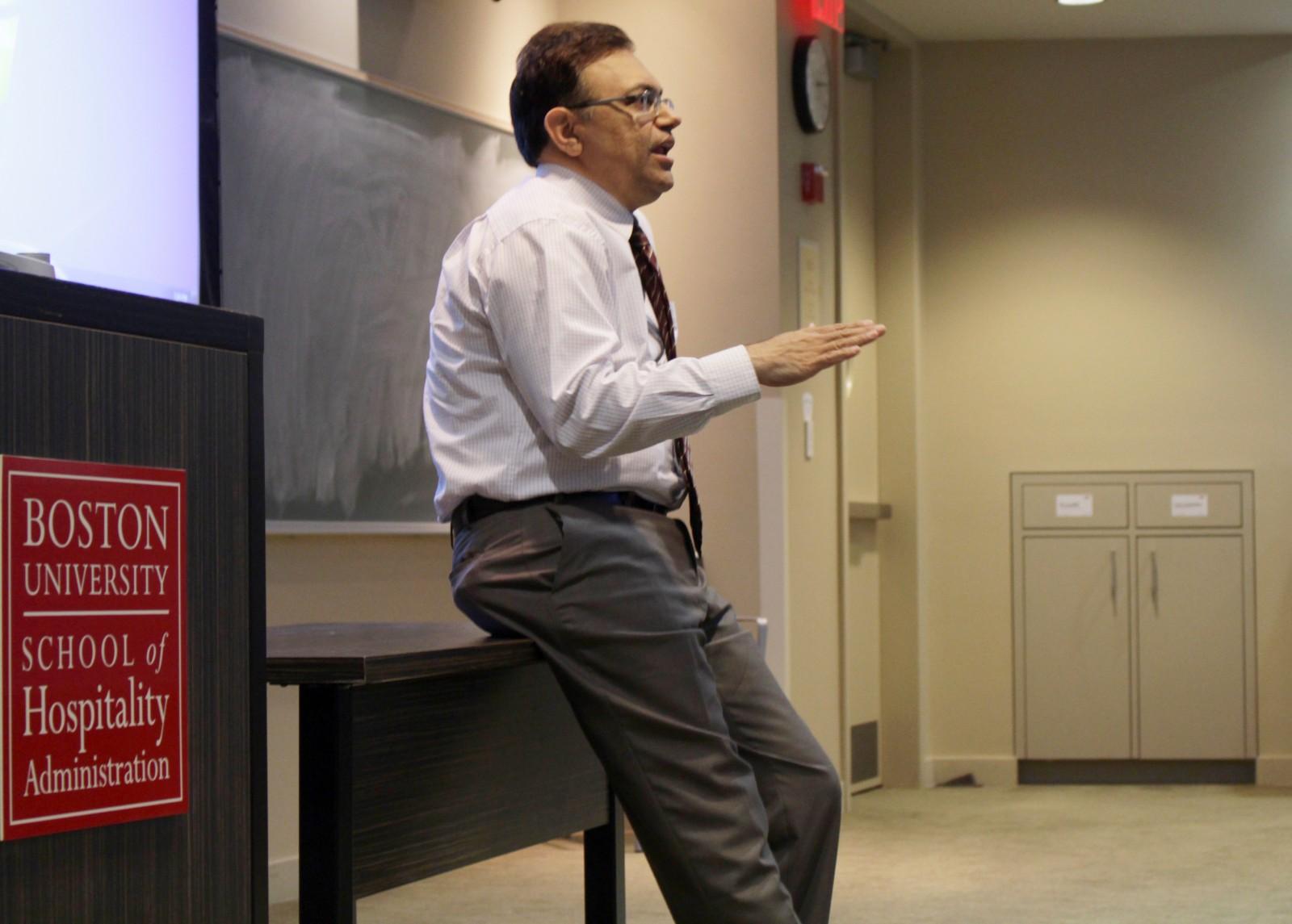 Arun Upneja, dean of the School of Hospitality Administration, speaks at an information session for the school’s first-ever hospitality app competition. PHOTO BY BRIGID KING/ DAILY FREE PRESS STAFF 