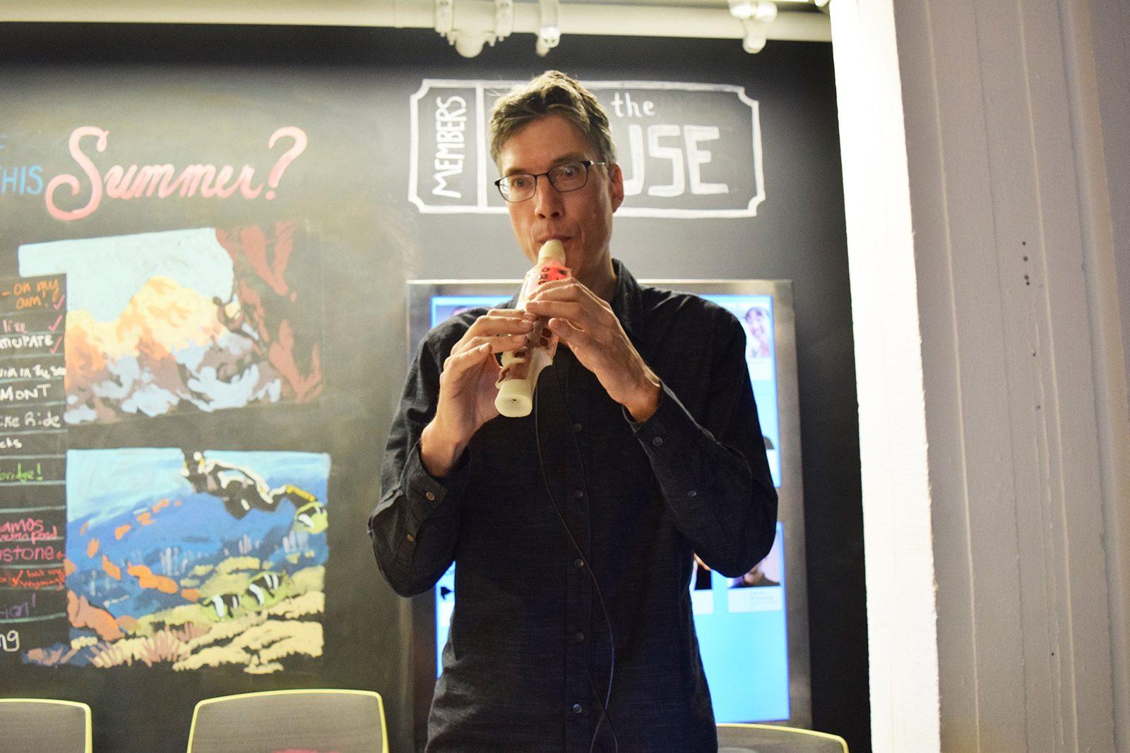 Michael Shonle plays his 3-D printed electric recorder at SMASH: Fusing Music, Art, and Technology, a HUBweek event hosted by Workbar in Cambridge. PHOTO BY ASHLEY GRIFFIN/ DAILY FREE PRESS CONTRIBUTOR 
