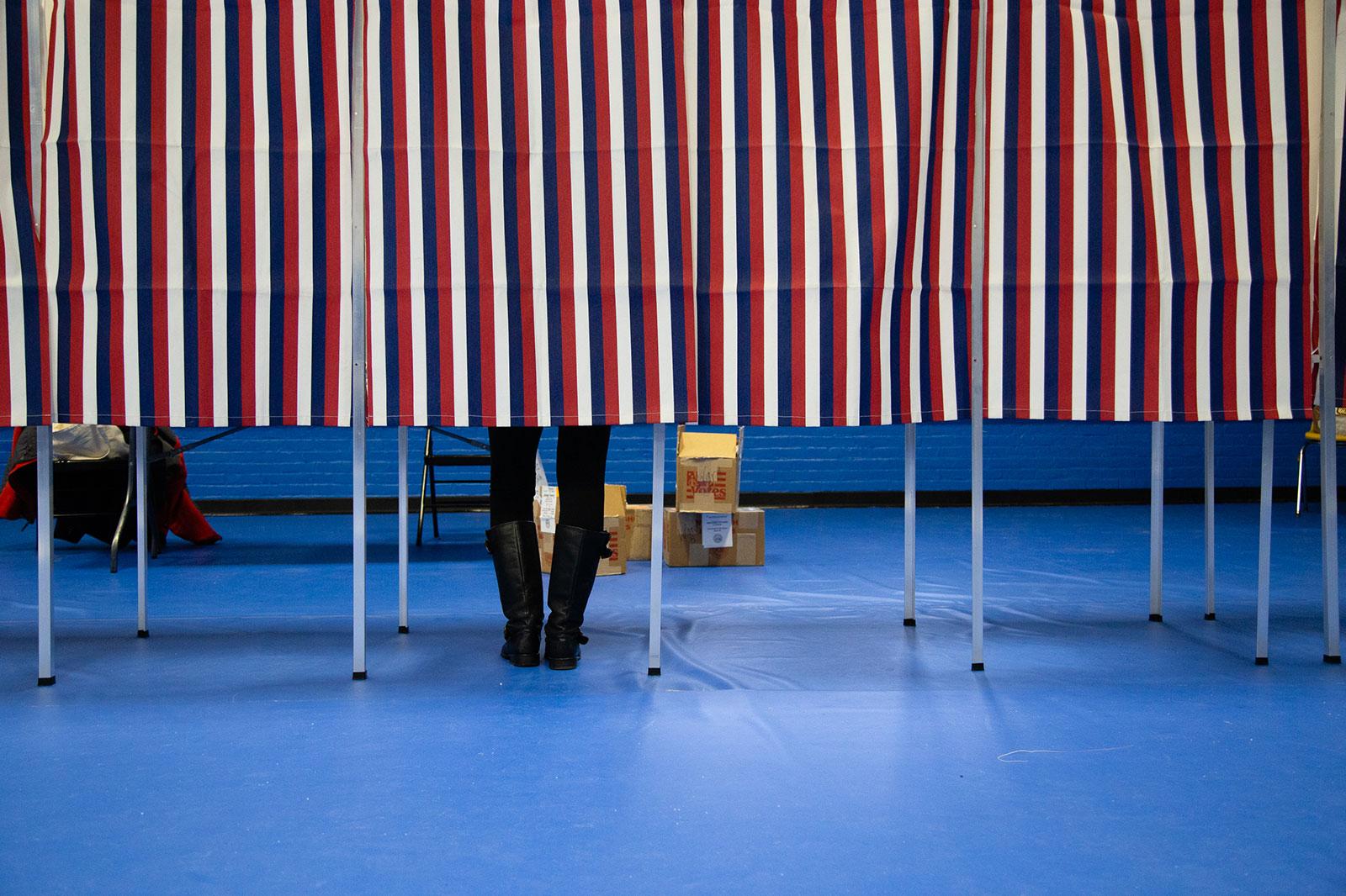 A person fills out their ballot at the Ward 5 polling station in Concord, New Hampshire during the New Hampshire primary Feb. 11. Massachusetts constituents will be able to vote early in the state’s March 3 primary for the first time ever. SOPHIE PARK/ DFP FILE