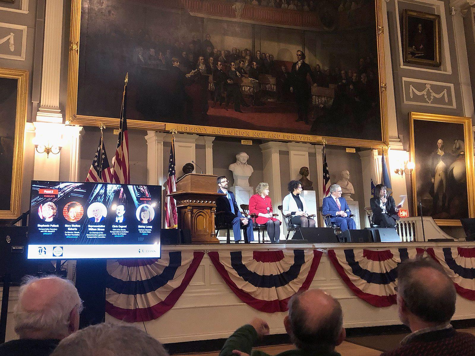 A panel of Boston Globe Spotlight journalists and city officials at Faneuil Hall Tuesday for a forum discussing the Globe’s three-part series on the city’s traffic, “Seeing Red.” VANESSA KJELDSEN/ DAILY FREE PRESS STAFF