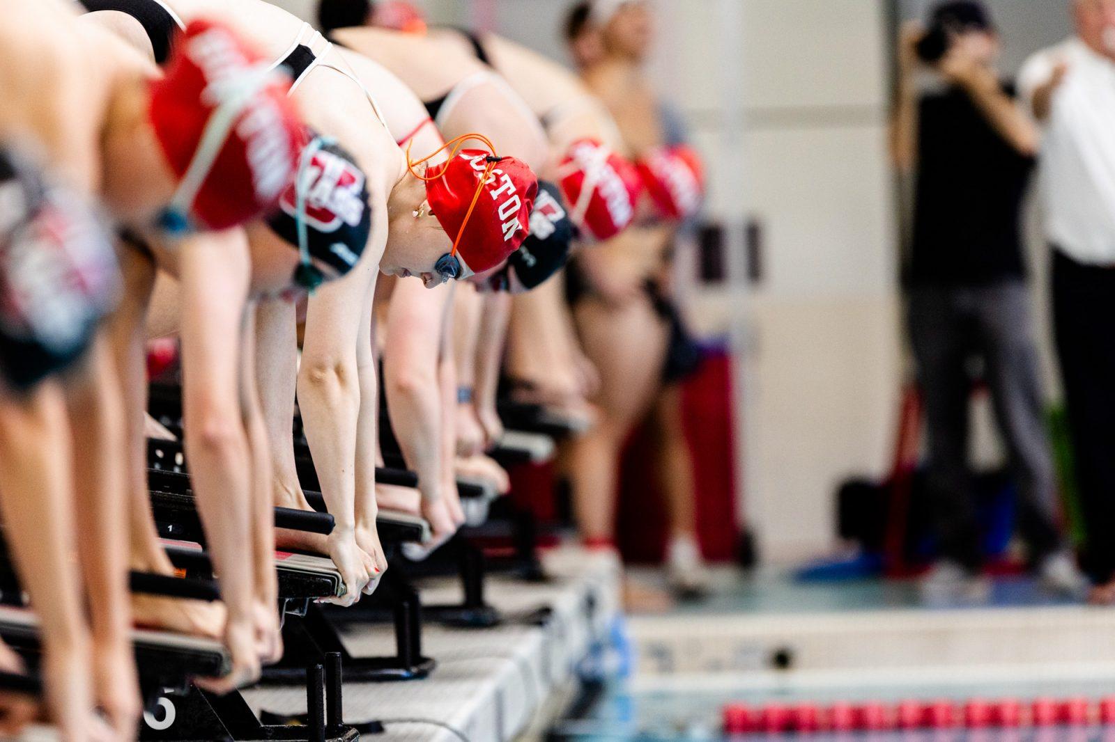 Senior Fia McCarty takes her mark on the starting block before a race on Nov. 9. The men’s and women’s swimming and diving teams won three events and set new top-10 program times during the Terrier Invite over the weekend. COURTESY OF BU ATHLETICS 
